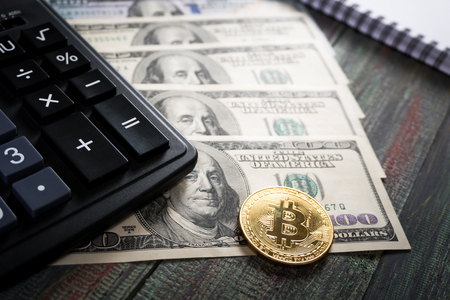 Bitcoin and keyboard calculator in a business office. Bitcoin golden coin New virtual moneyの写真素材
