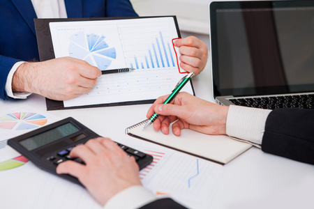 Team work process. Marketing strategy brainstorming. Paperwork and digital in office.の写真素材