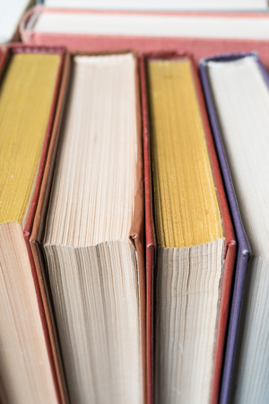 Many books in a bookstore or library on wooden background with copy spaceの写真素材