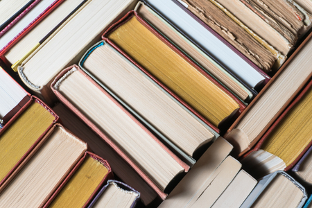 Many books in a bookstore or library on wooden background with copy spaceの写真素材