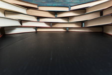 Book stacking open book hardback books on wooden table. copy spaceの写真素材