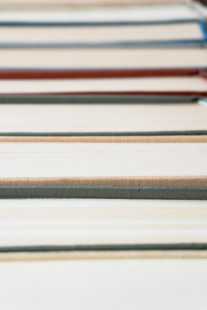Many books in a bookstore or library on wooden background with copy spaceの写真素材