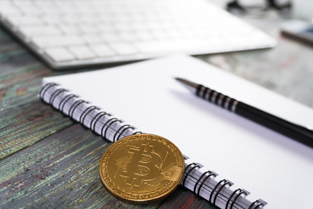 Bitcoin in a business office. Bitcoin golden coin New virtual moneyの写真素材
