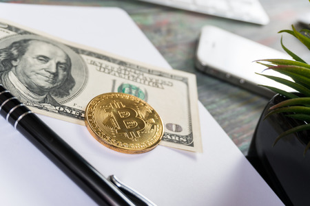 Bitcoin in a business office. Bitcoin golden coin New virtual moneyの写真素材