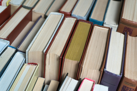 Many books in a bookstore or library on wooden background with copy spaceの写真素材