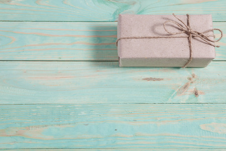 Presents for any holiday concept. Border of decorative gifts wrapped kraft paper tied with tourniquet for christmas, valentine day or birthdayの写真素材