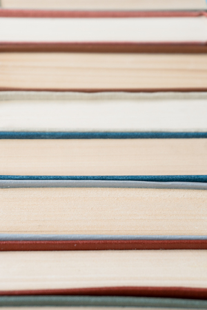 Many books in a bookstore or library on wooden background with copy spaceの写真素材