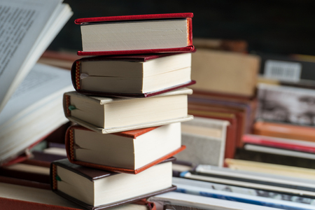 Many books in a bookstore or library on wooden background with copy spaceの写真素材
