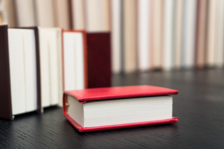 Stack books on wooden background. Back to school with copy space.の写真素材