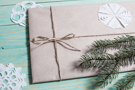 Gift boxes wrapped kraft paper tied with twine and paper snowflake and tied with twine. with copy spaceの写真素材