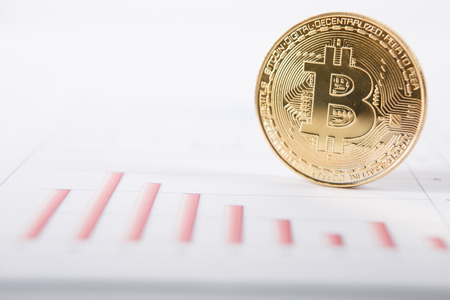 Gold bitcoin and quotes charts. A visual representation of digital cryptocurrencies. Bitcoin are fully dematerialized and decentralized electronic currenciesの写真素材