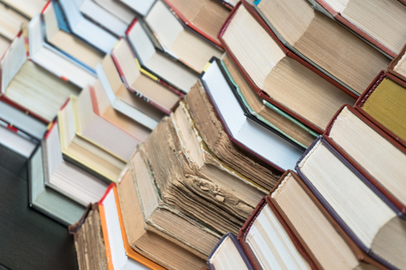 Many books in a bookstore or library on wooden background with copy spaceの写真素材