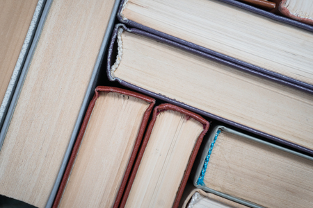 Book stacking open book hardback books on wooden table. copy spaceの写真素材