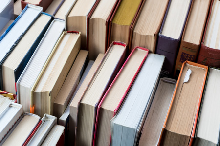 Many books in a bookstore or library on wooden background with copy spaceの写真素材
