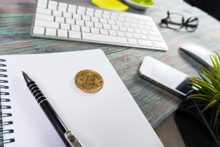 Bitcoin in a business office. Bitcoin golden coin New virtual moneyの写真素材