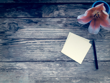 Tulip on dark barn wood planks background. Empty space for copy, text, lettering.の写真素材