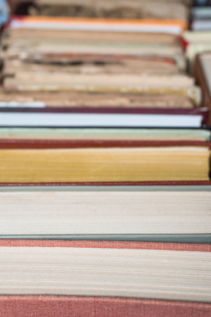 Many books in a bookstore or library on wooden background with copy spaceの写真素材