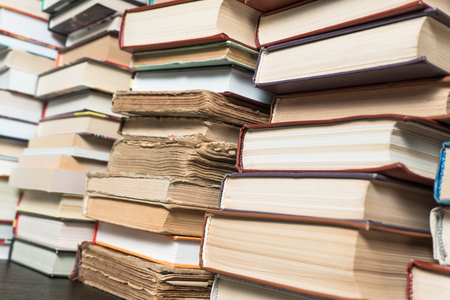 Many books in a bookstore or library on wooden background with copy spaceの写真素材
