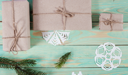Gift boxes wrapped kraft paper tied with twine and paper snowflake and tied with twine. with copy spaceの写真素材