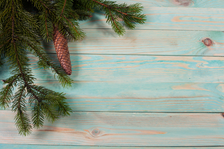 Christmas background with spruce branches on wooden board with copy spaceの写真素材