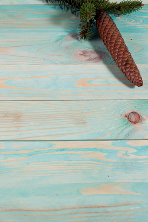 Christmas background with spruce branches on wooden board with copy spaceの写真素材