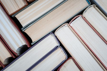 Book stacking open book hardback books on wooden table. copy spaceの写真素材
