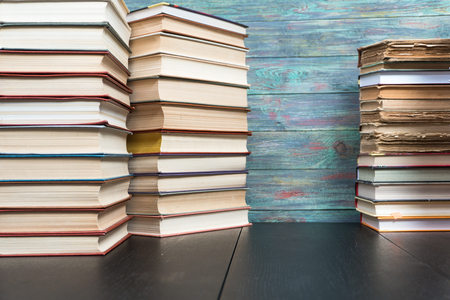 Stack books on wooden background. Back to school with copy space.の写真素材