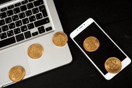 Bitcoin coin symbol on laptop future concept financial currency crypto currency sign. With copy...
