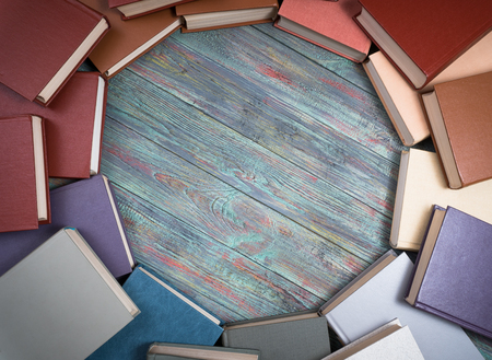 Book stacking open book hardback books on wooden table. copy spaceの写真素材