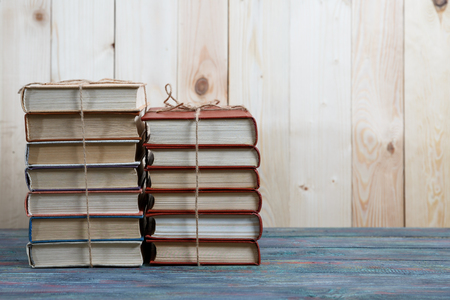 Education and reading concept - group of colorful books on the wooden tableの写真素材