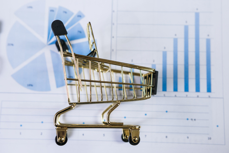 Shopping cart on a financial report. Online shopping.の写真素材