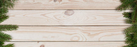 Christmas and happy New year. On a wooden background juicy spruce branches, Christmas decorations,...