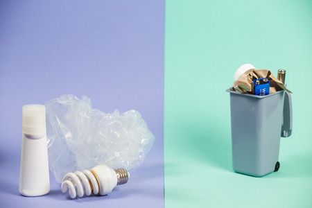 Recycling. Materials for recycle and reuse on pastel background. Ecology concept, a lot of recyclable objects in containersの写真素材