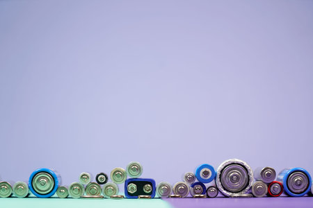 Ecology recycling concept. Many different types used or new battery, rechargeable accumulator,...