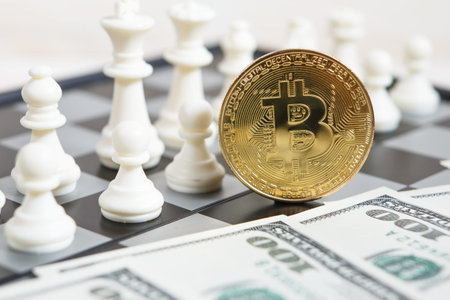 Golden bitcoin coin symbolizes elements of virtual economy or crypto currency with chess board