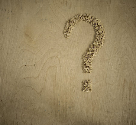 Pasta on a old Chalkboard forming a girl. Raw pasta background.