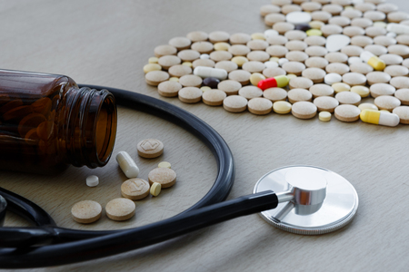 Colorful drug pills in shape of heart. pharmaceutical conceptの写真素材