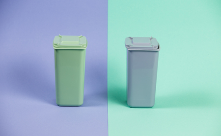 Recycling. Ecology concept. Closed waste containers on pastel double backgroundの写真素材