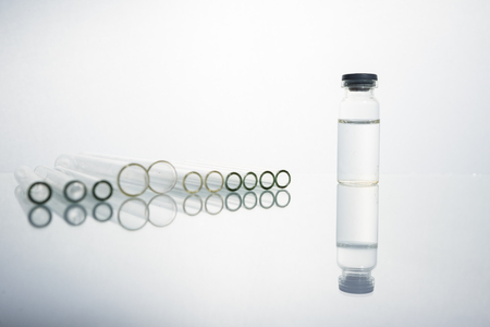 Group of vials with medication on blue methacrylate table. Horizontal composition.の写真素材