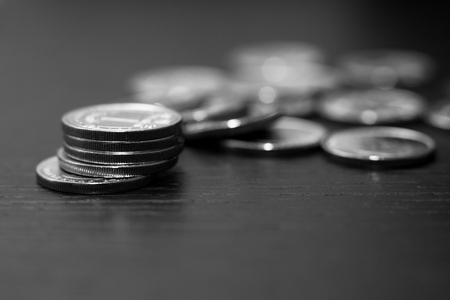 Stack of coins black and white macro. Ukrainian coins , Concept of saving moneyの写真素材