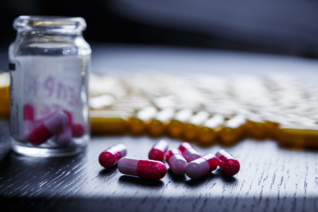 Colorful medications and supplements, a pill bottle, close-up. Medicine and pharmacists.