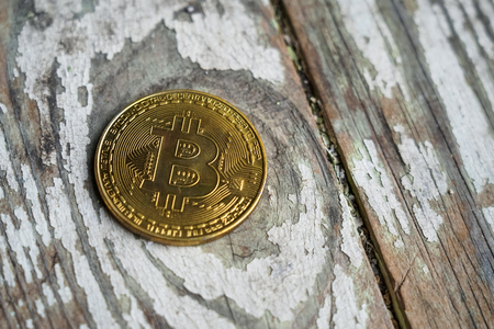 Gold Bitcoin money on wooden table. Electronic crypto currency. Business concept.の写真素材
