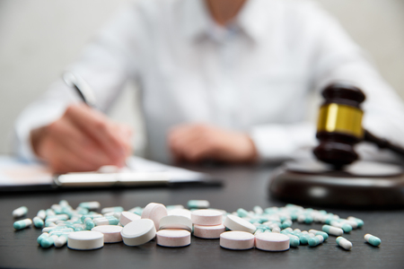 Medicine law concept. Judges gavel with pills close upの写真素材
