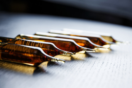 Horizontal perspective view of many brown ampoules setの写真素材