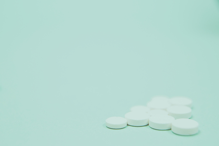 Assorted medical drugs and syringe on blue background, with copy spaceの写真素材