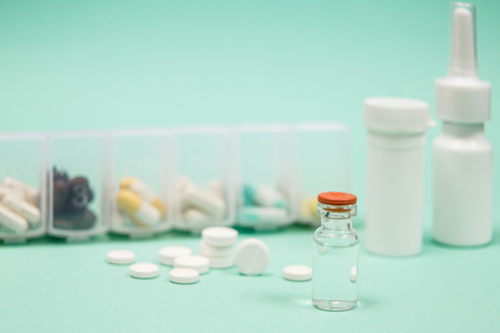 Medical ampoules, syringe and pills with copy spaceの写真素材