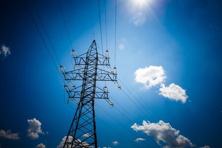 Electricity is the major energy of the world. High voltage post. High voltage tower sky background. Aerial industrial background group of transmission towers.の写真素材