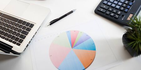 Close up view of bookkeeper or financial inspector hands making report, calculating or checking balance. Marketing strategy brainstorming. Paperwork and digital in office.の写真素材