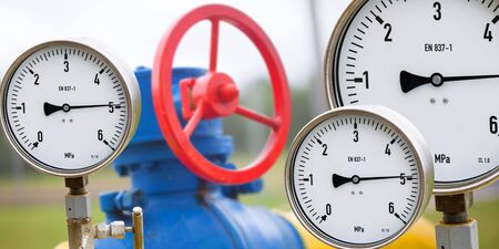 Gas manometer on background Valves manual in the production process. Production process used manual valve to control the system, Operator open and close or function the valve for controlled pressure or gas and oil flow rate.の写真素材