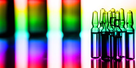 Group object of liquid medicinal agent in limpid glassware in medical laboratory. Group of ampoules with a transparent medicine in medical laboratoryの写真素材